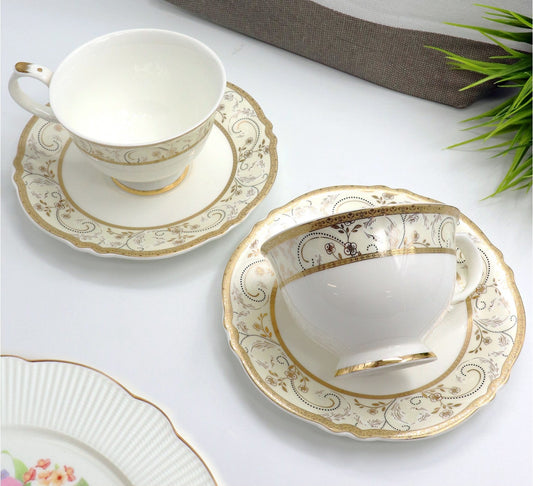 Royal Gold porcelain cup and saucer pair with a gold band, 325 mL