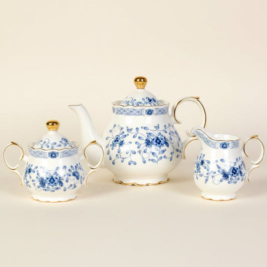Blue Flower porcelain teapot with blue florals and a gold trim
